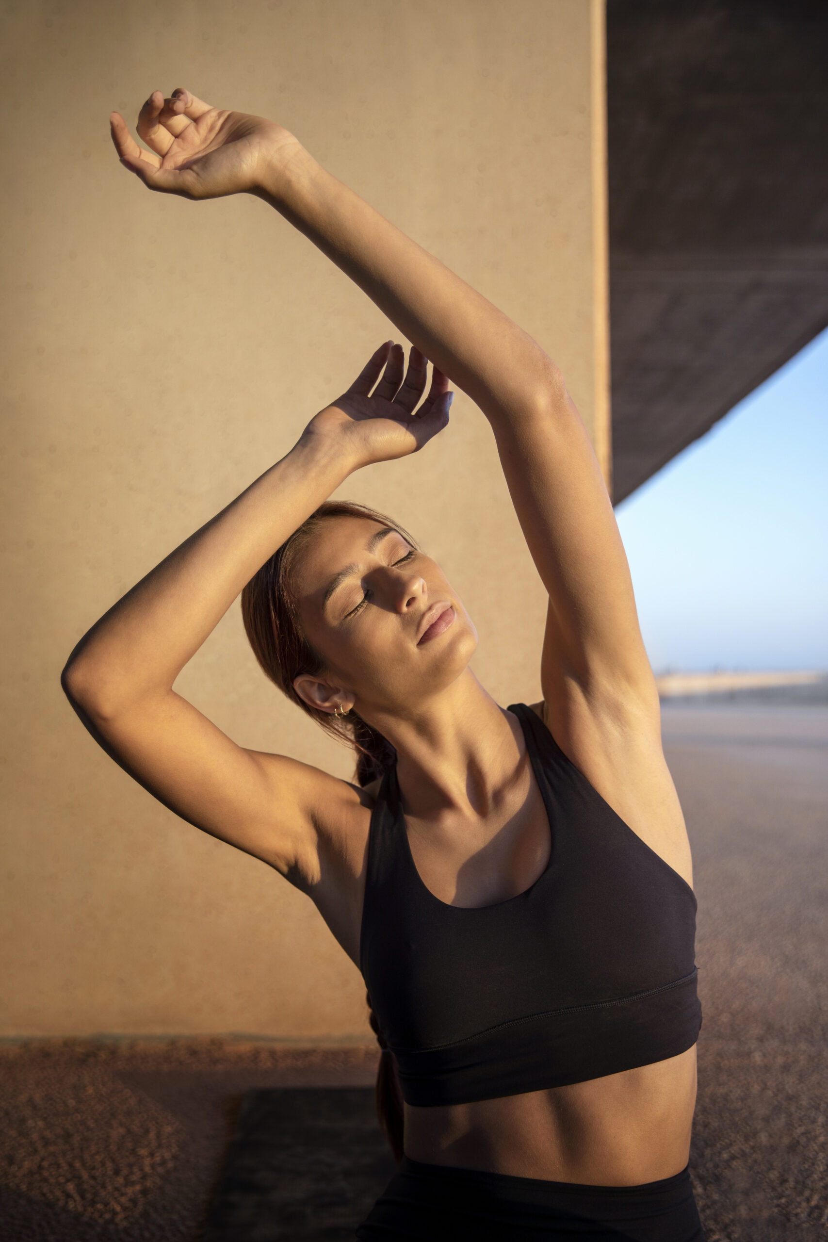 young-woman-stretching-preparing-exercise-outdoors